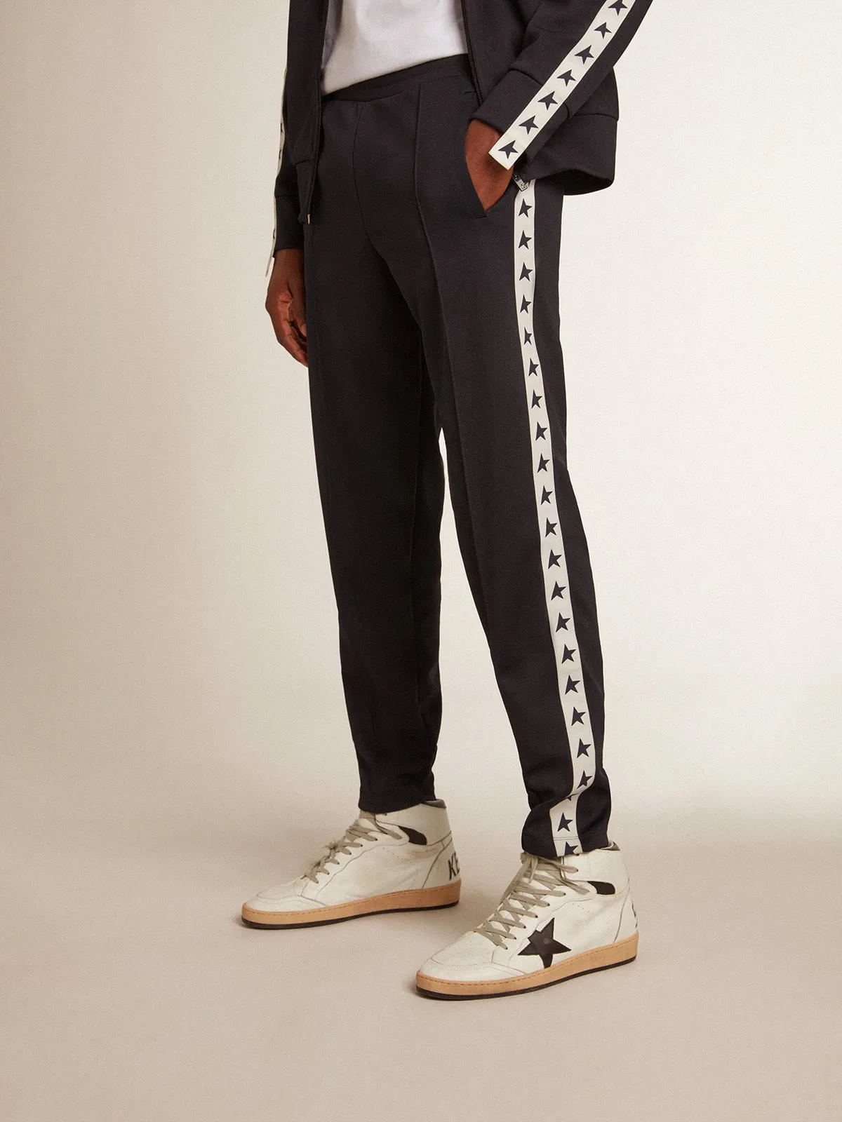 Dark blue joggers with contrasting strip and stars